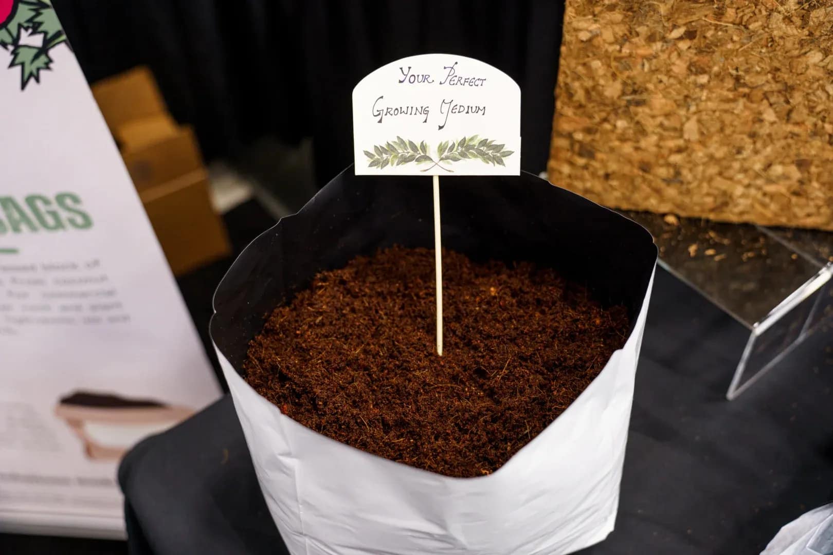 Open-top commercial coco coir grow bag filled with hydrated pith-chip growing substrate